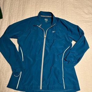 Reebok lightweight reflective, running jacket, blue, and color size large